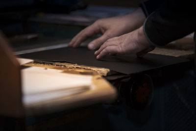 N hand shows material for production of book covers calendars