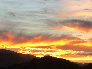 Scenic view of dramatic sky during sunset