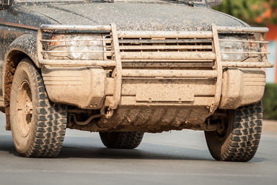 Dirty car on road