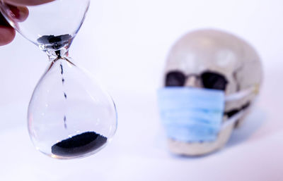 Close-up of drinking glass on white background