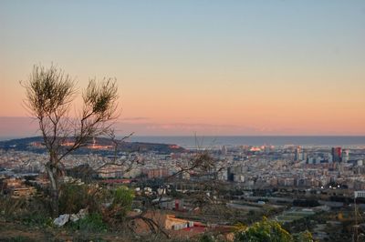 High angle view of city at sunset