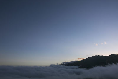 Scenic view of mountains against sky during sunset