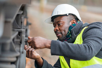 Man repairing train 