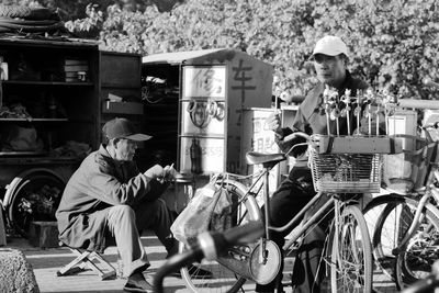 Men sitting outdoors