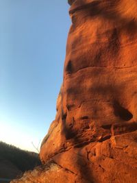 Low angle view of rock formation against clear sky