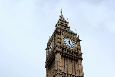 Low angle view of big ben against blue sky