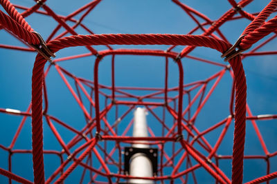 Low angle view of metallic structure against sky