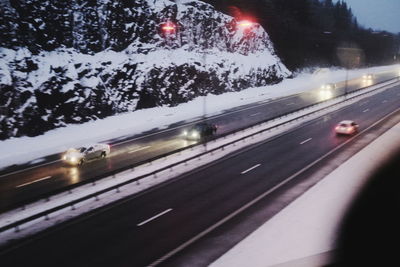 Blurred motion of car on road in winter