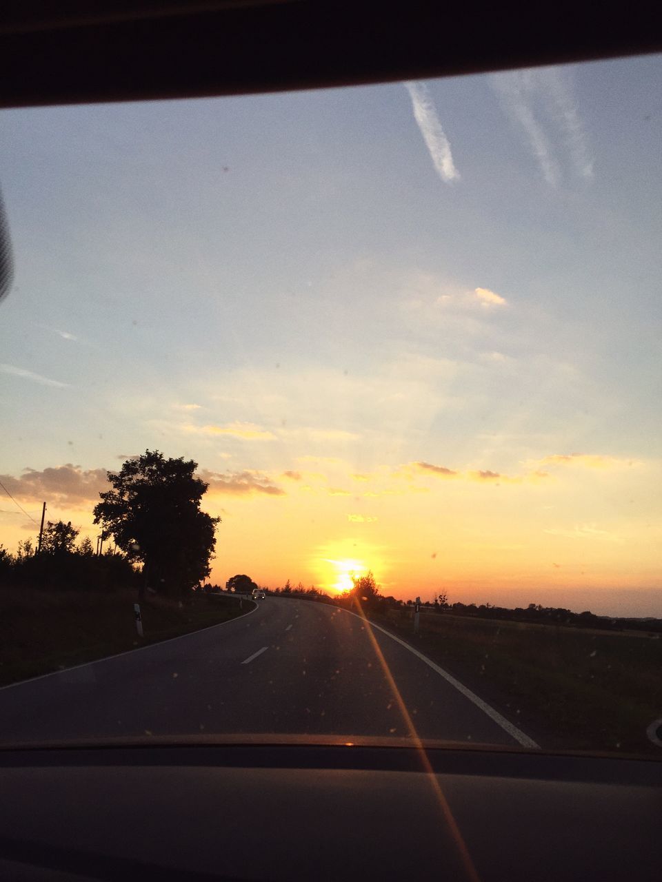 ROAD AGAINST SKY DURING SUNSET