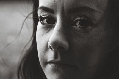 Close-up portrait of beautiful woman at home