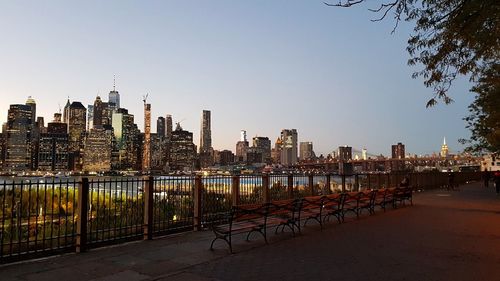 Manhattan skyline from brooklyn heights promenade - river and buildings against clear sky