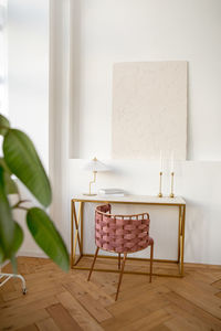 Table with lamp and books in studio