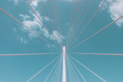 Low angle view of cables against blue sky