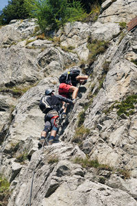 People walking on rock