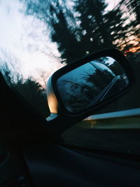 Reflection of car on side-view mirror