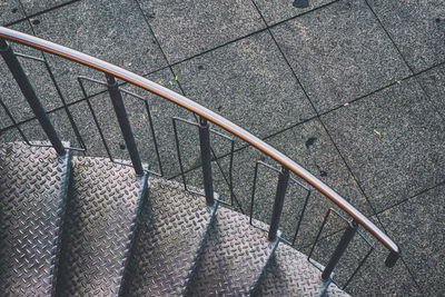 Metal staircase with railing by footpath
