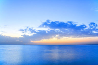 Scenic view of sea against sky at sunset