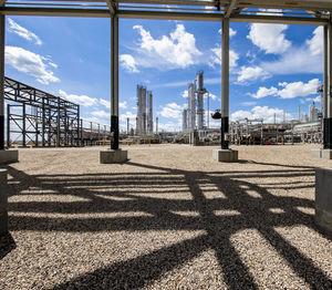 Natural gas plant structures against blue sky