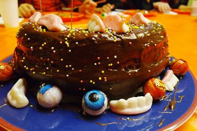 Close-up of homemade chocolate cake on table during halloween