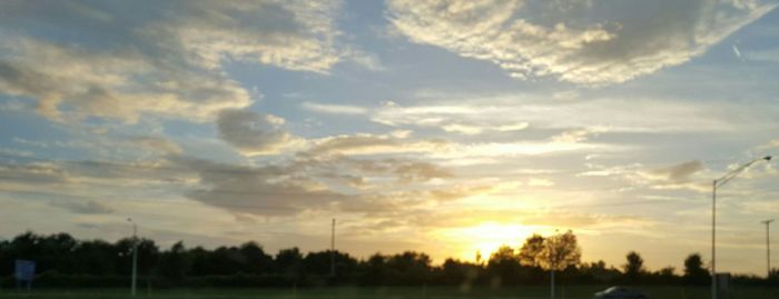 Scenic view of landscape against sky at sunset