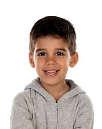 Portrait of smiling boy against white background