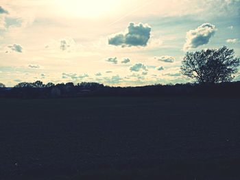 Scenic view of landscape against sky at sunset