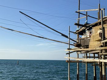 Sailboat on sea against sky