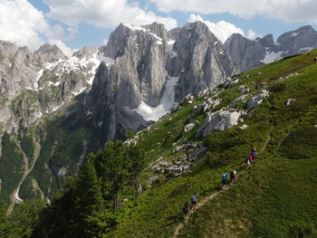 A group of hikers hiking in grebaje national park, montengro. the picture was taken in june 2021