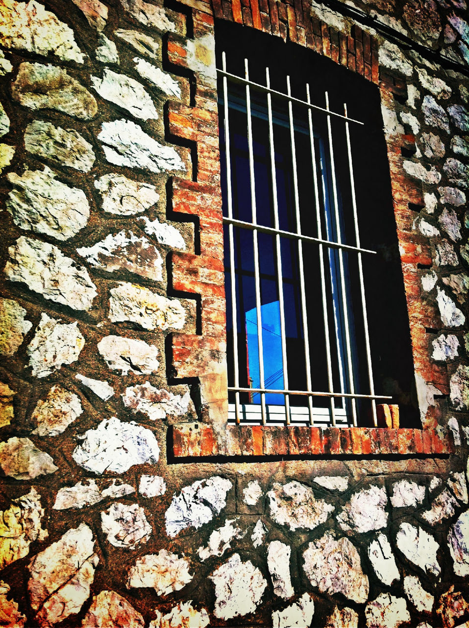 brick wall, architecture, built structure, building exterior, window, wall - building feature, stone wall, low angle view, house, brick, abandoned, old, wall, weathered, building, day, blue, outdoors, no people, damaged