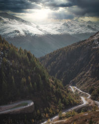 High angle view of road amidst trees against sky