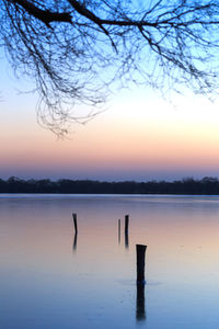 Scenic view of lake at sunset