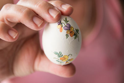 Midsection of woman holding easter egg