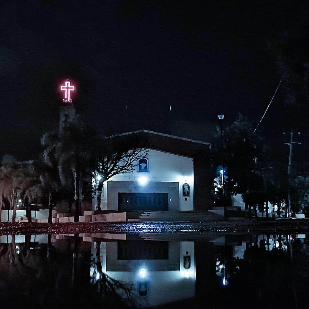 night, reflection, illuminated, architecture, built structure, building exterior, water, no people, building, city, nature, waterfront, sky, standing water, outdoors, lake, text, travel destinations, nightlife