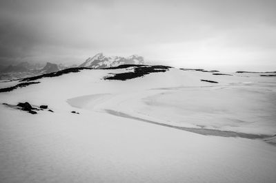 Scenic view of snow covered mountain against sky