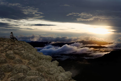 Low angle view of silhouette rocks against sky during sunset