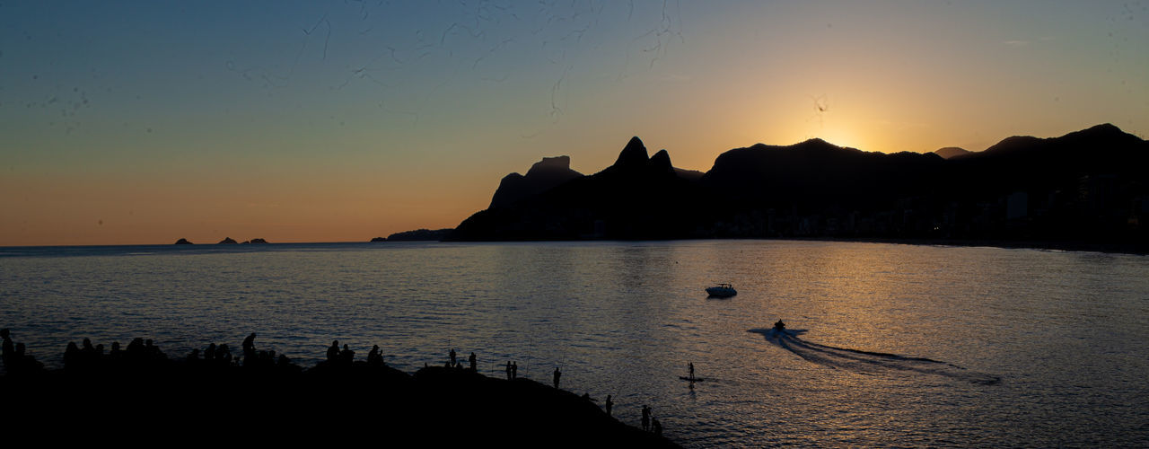 SILHOUETTE OF BUILDINGS AT SUNSET