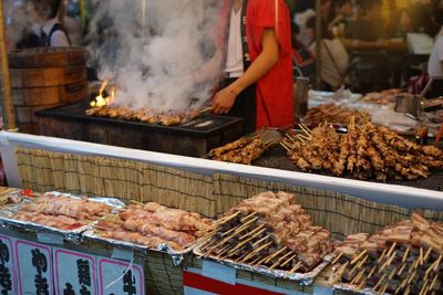 Skewers on barbecue grill at food stall