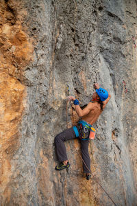 Full length of baby boy on rock