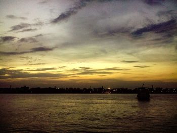 Scenic view of river at sunset