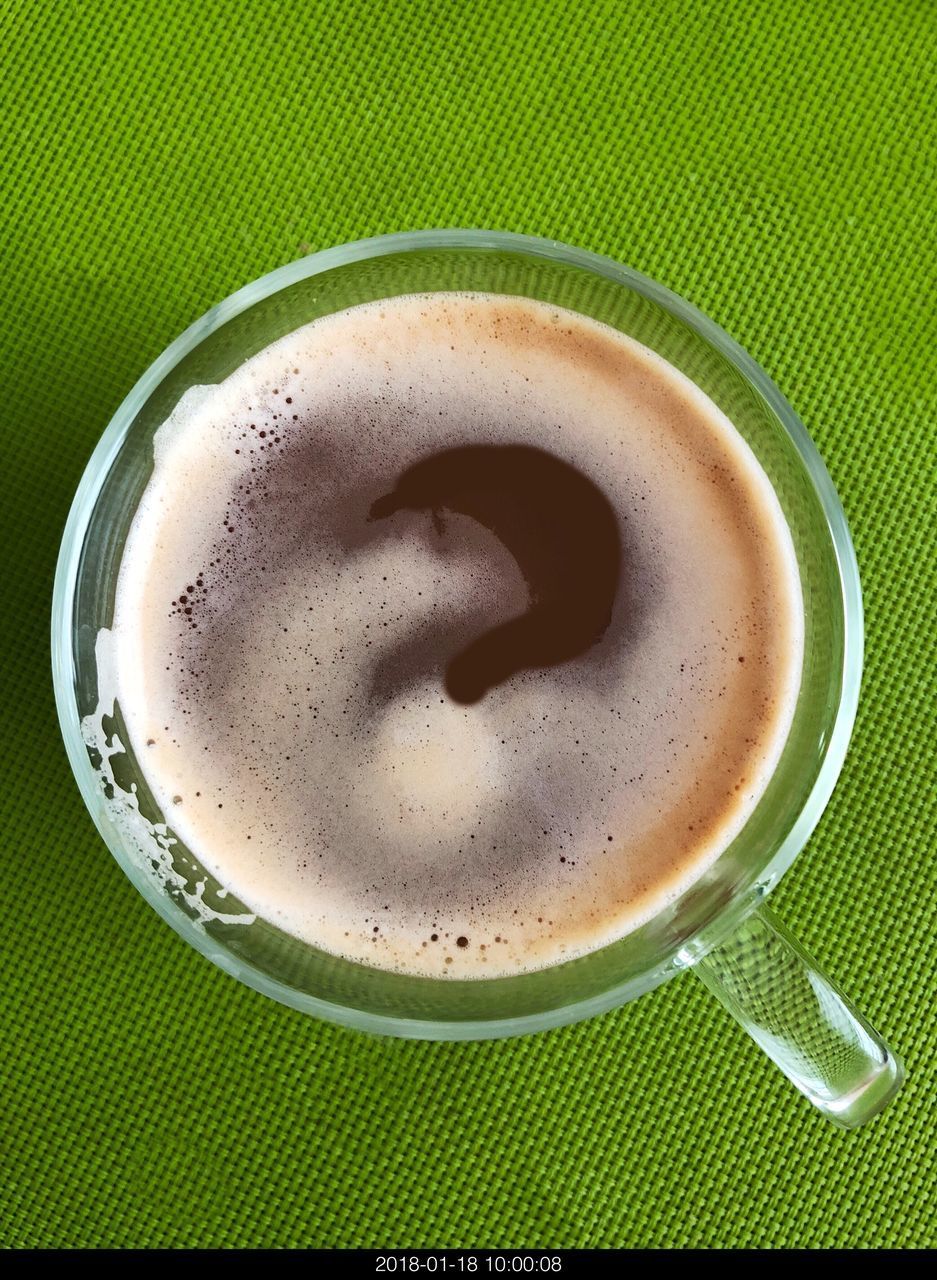 CLOSE-UP OF COFFEE CUP ON TABLE