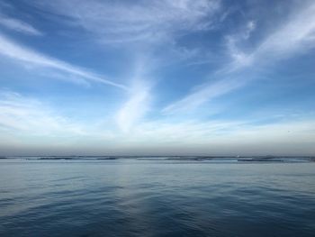 Scenic view of sea against blue sky