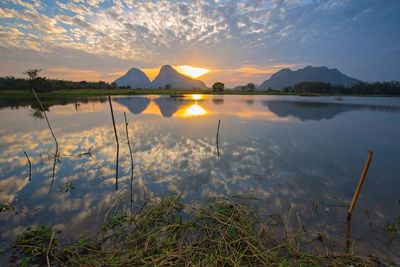 Scenic view of lake against sky during sunset