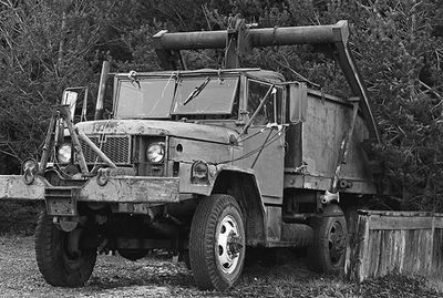 Old vehicle parked on field