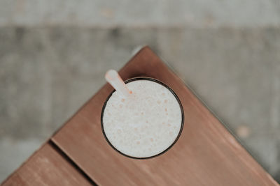 Directly above shot of drink on wooden table