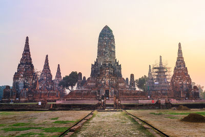 View of old temple against building