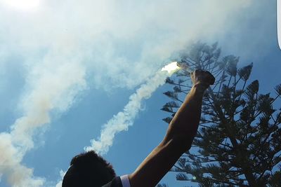 Low angle view of silhouette tree against sky