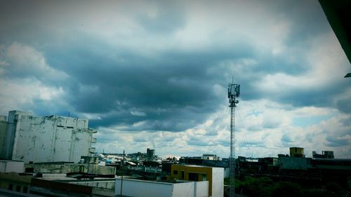 Low angle view of communications tower against sky