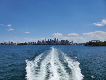 Panoramic view of sea and buildings against sky