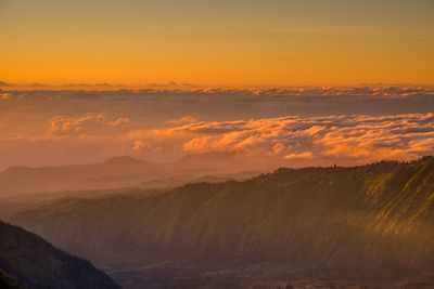 Scenic view of mountains against sky during sunset