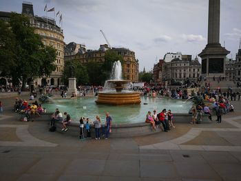 Group of people in front of buildings